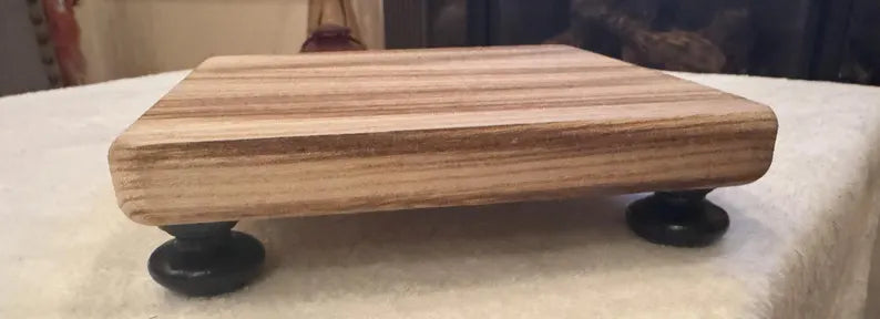 Wooden decorative shelf with black feet